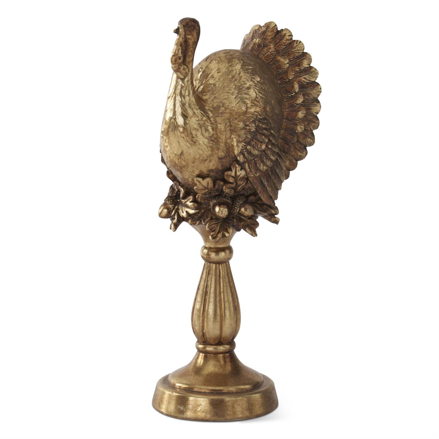 antique gold statue of a turkey on a column pedestal