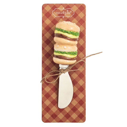 Hamburger-shaped spreader on a checkered card with 'mudpie' branding