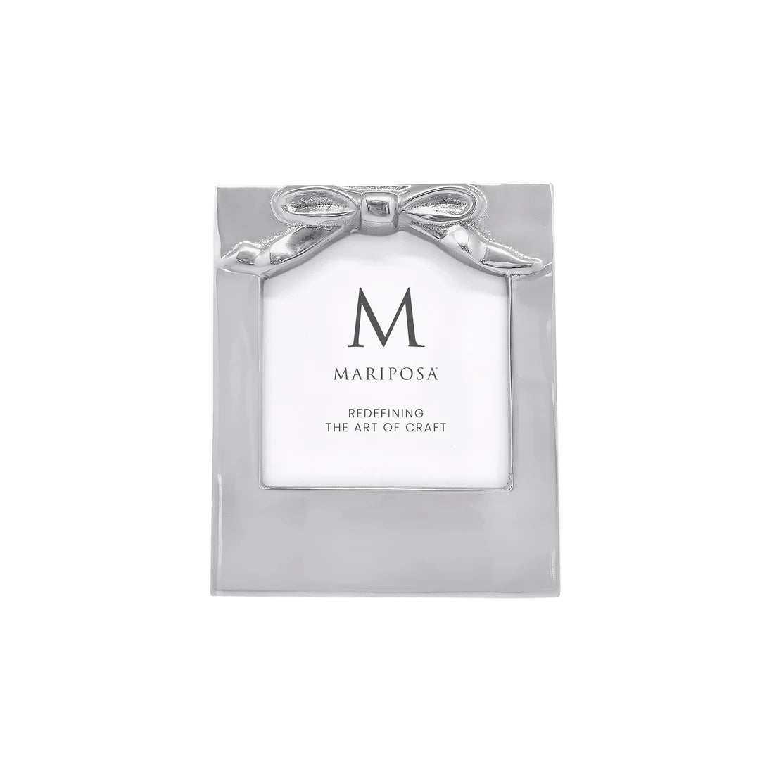 Silver picture frame with bow design on on the top.