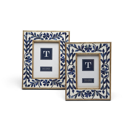 Two ornate photo frames with blue floral patterns on a white background, featuring a '5x7' indication in the center.