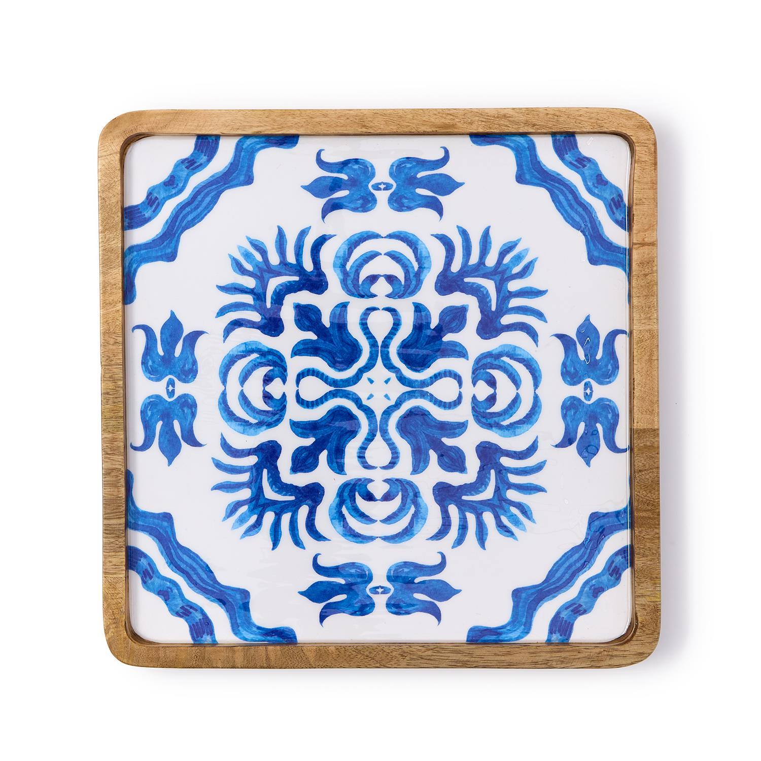 Tile tray with a blue and white pattern on a white background and a mango wood edge
