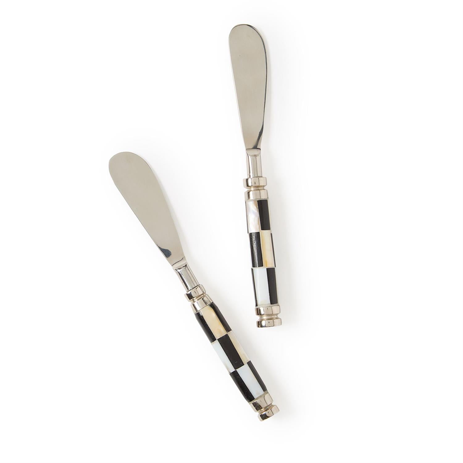 Two spreaders with checkered handles and stainless-steel blades