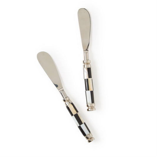 Two spreaders with checkered handles and stainless-steel blades