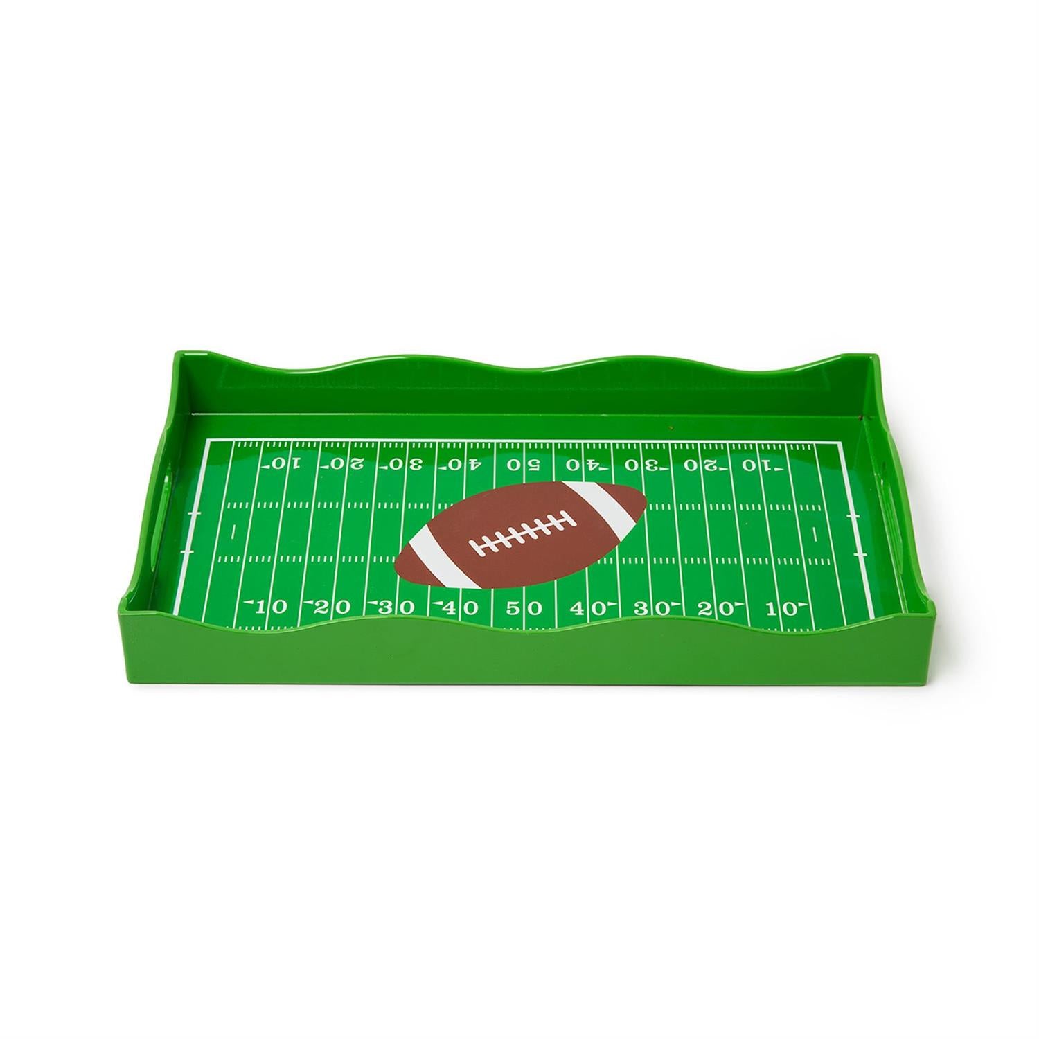 Green tray with football field design and a football on a white background