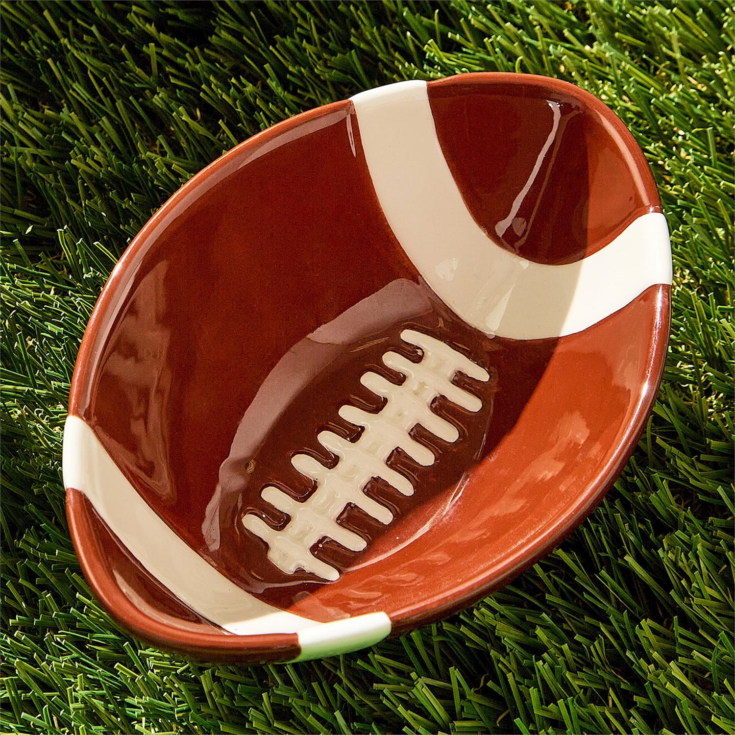 Football-shaped bowl on grass