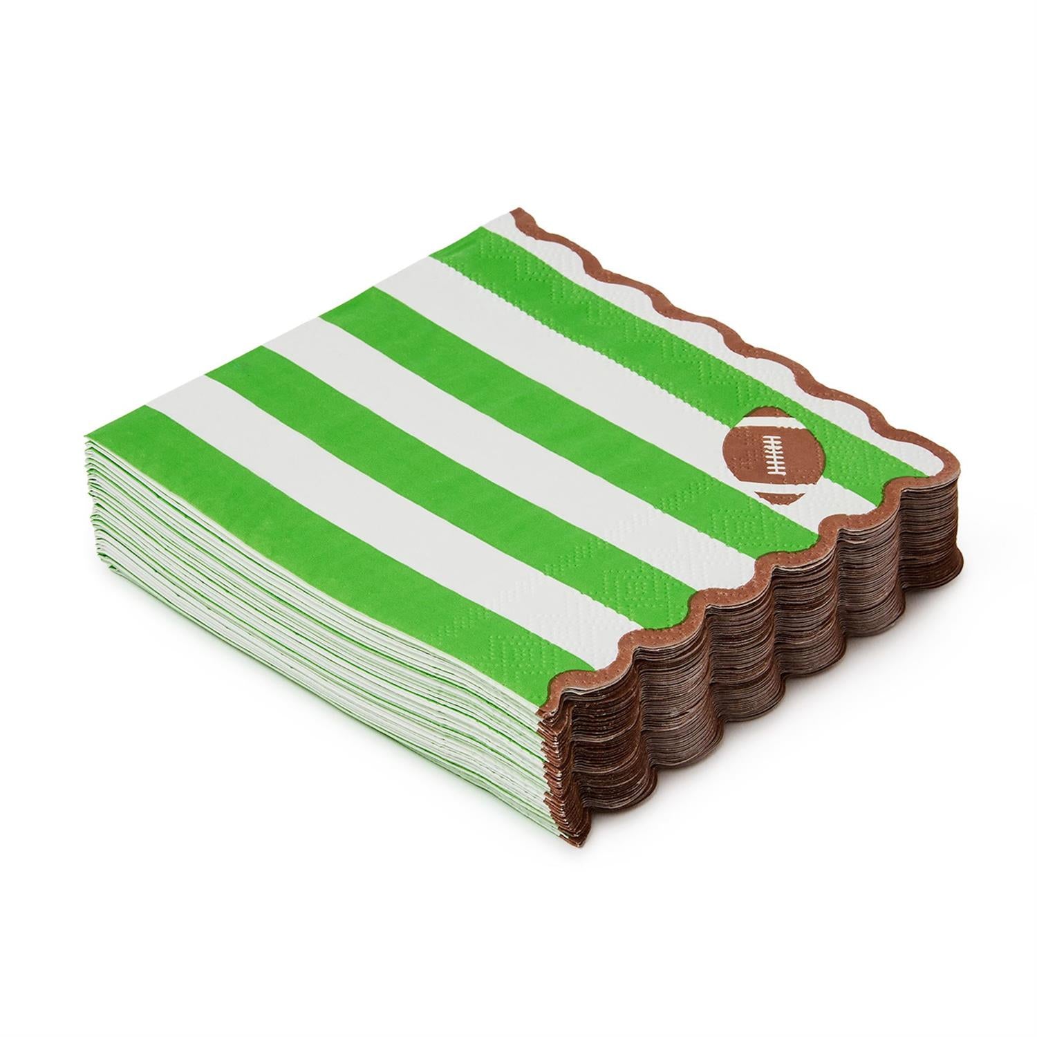 Stack of green and white striped scalloped edged cocktail napkins with a football in the corner