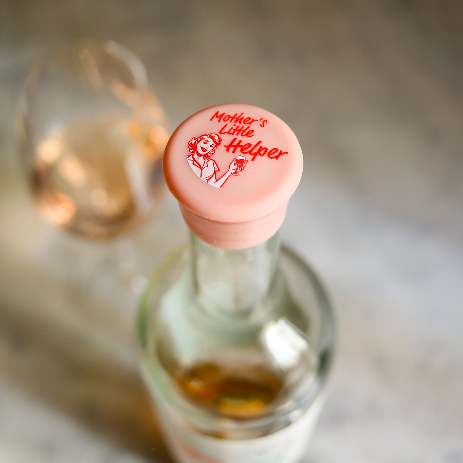pink wine bottle cap labeled 'Mother's Little Helper'