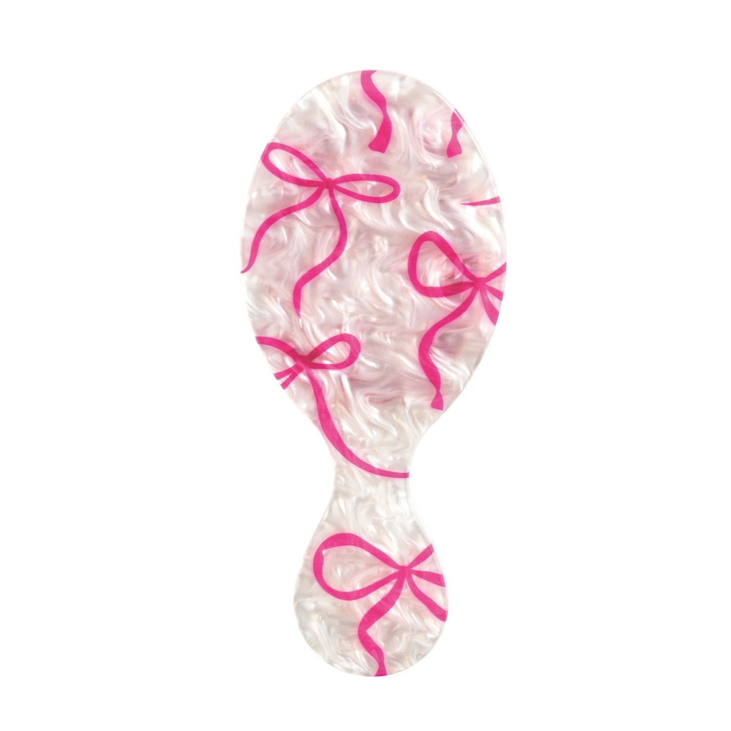 A Mudpie single oval-shaped hairbrush with a white and pink wavy pattern and bright pink bow motifs, isolated on a solid white background.