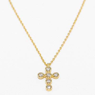 Meghan Browne ABI gold chain necklace with a cross that features clear crystals