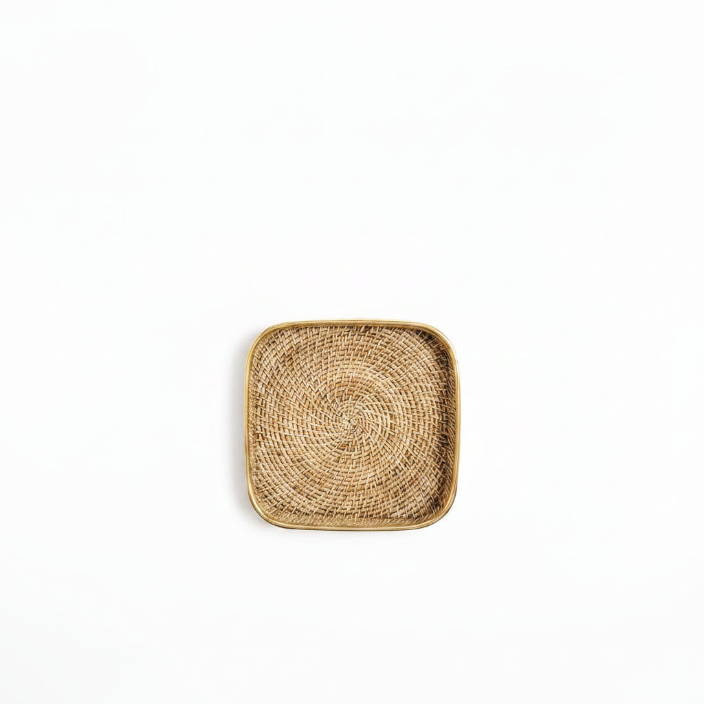 square woven rattan tray with a brass rim