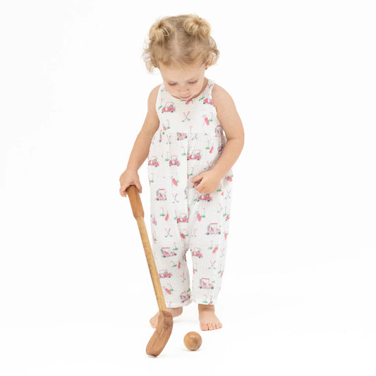 Girl wearing an Angel Baby Baby Golf Carts Tie Back Romper with pink golf cart and golf accessories design