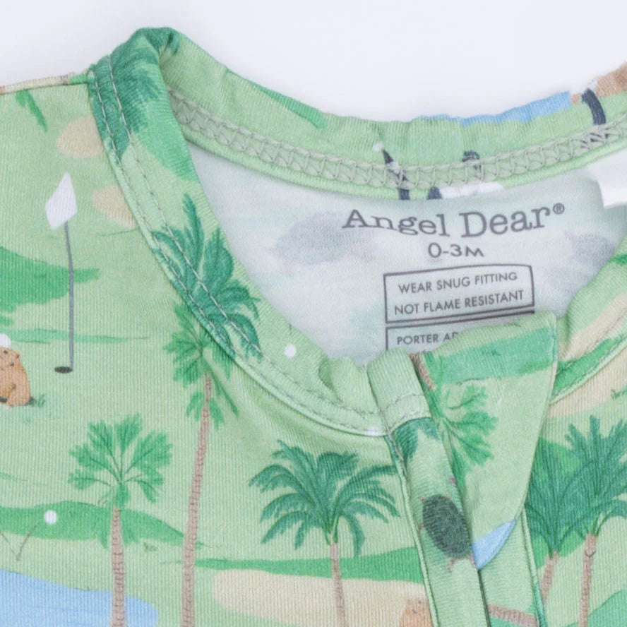 Close up of the closure of An Angel Baby Golf Oasis Animals 2 Way Zipper light green Footie with a golf course design featuring playful animals that may be found on a golf course. 