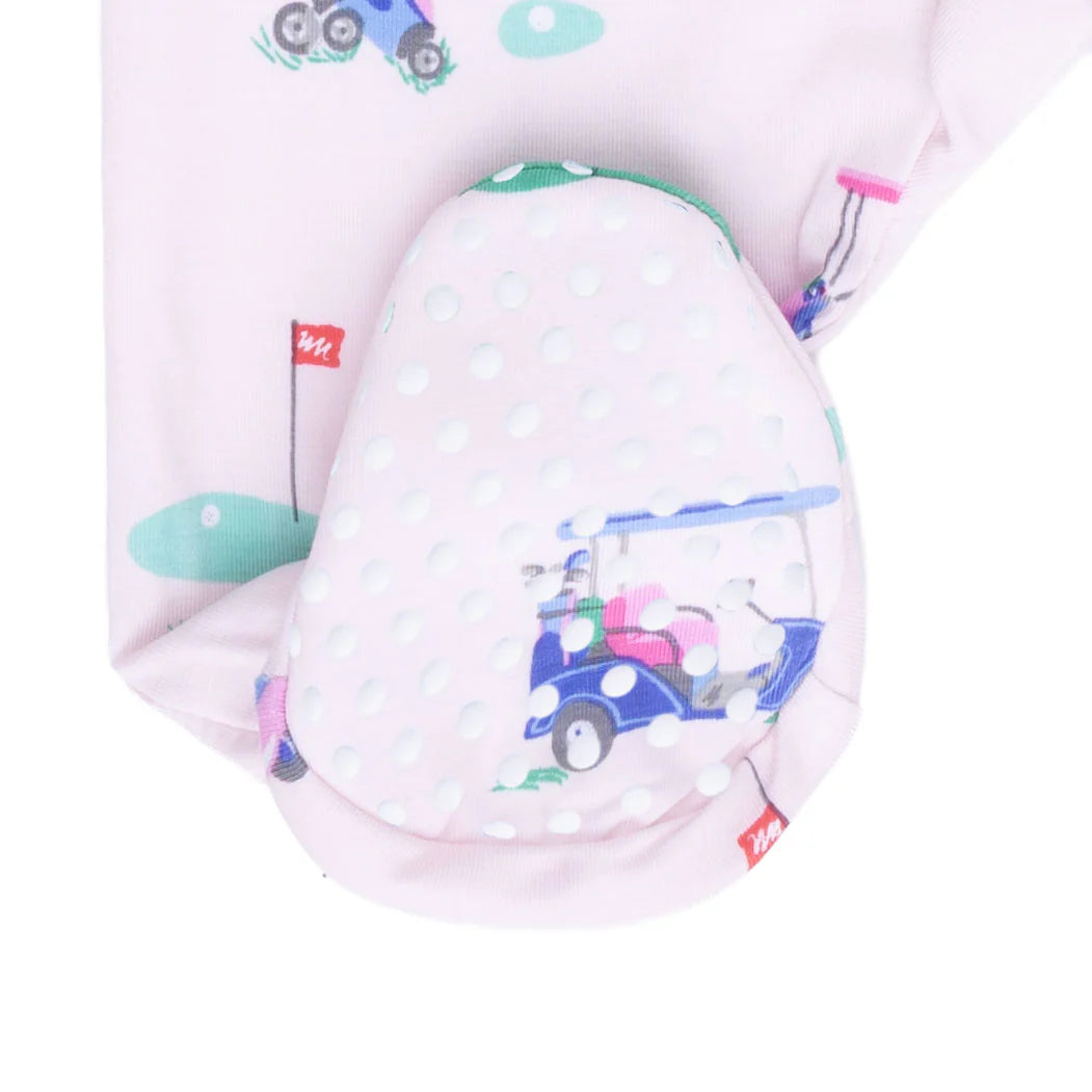 Rubber dotted foot of an Angel Dear Vintage Golf Carts Pink 2 Way Ruffle Back Zipper Footie