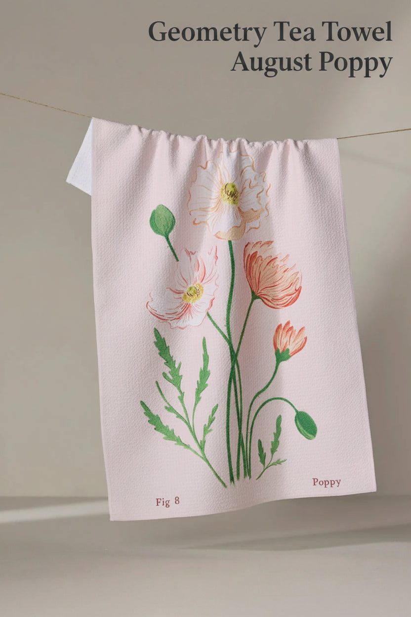 Geometry august poppy tea towel with Floral design towel hanging on a line against a neutral background