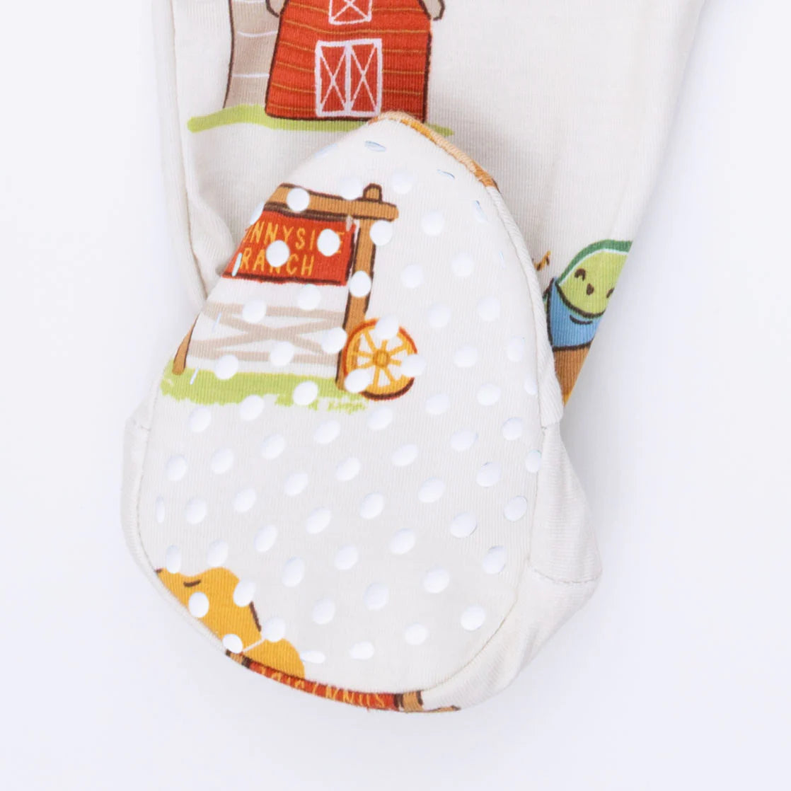 The rubber feet bottoms on an Angel Dear Avacado Toast American Gothic 2 Way Zipper Footie