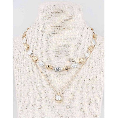 meghan browne back double gold and silver strand necklace with clear stone penant