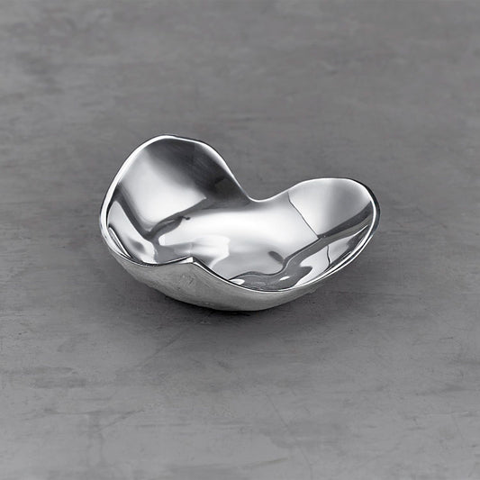 A silver, heart-shaped decorative dish by Beatriz Ball, designed for serving nuts and nibbles or holding small jewelry.