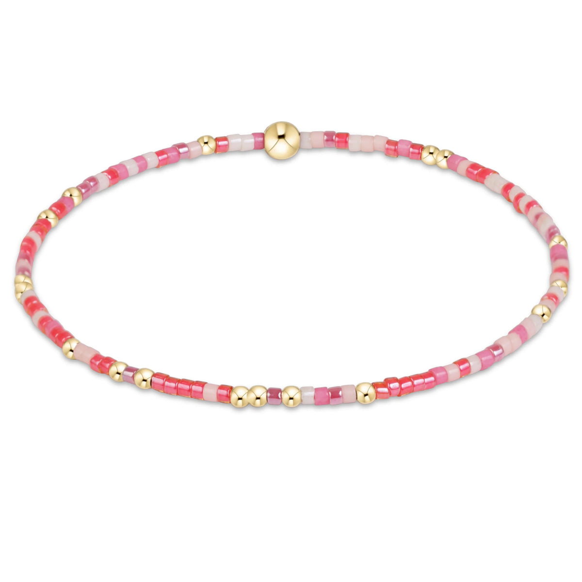 A delicate beaded enewton hope unwritten fashionably late bracelet with alternating pink and white beads, accented by small gold spacer beads and a larger polished gold clasp, shown on a plain white background.