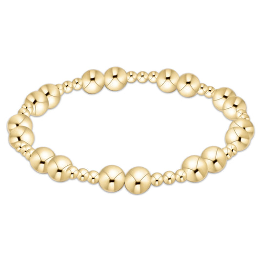 An enewton gold 6mm together beaded stretch bracelet with alternating large and small polished round beads, shown on a plain white background.