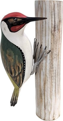 Woodpecker figurine on a wooden post