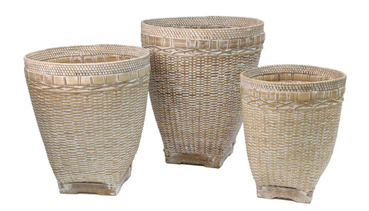 Three woven wicker baskets of different sizes by Banyan Designs