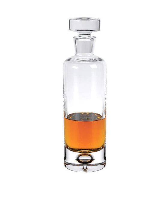 Image of a Crystal Galaxy Decanter by Badash shows a tall cylinder with a crystal stopper containing whisky.