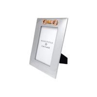 Silver picture frame with gold accent on a white background