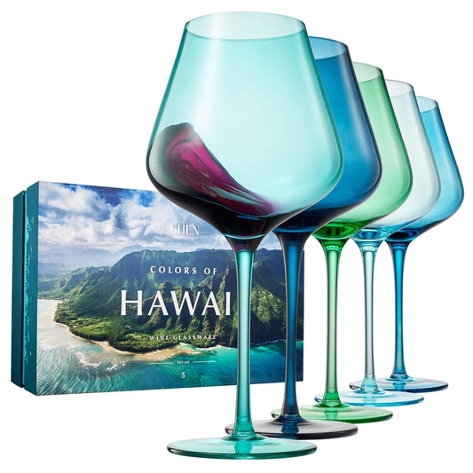 Picture shows 5 wine glasses, each in a beautiful shades of blue and teal resembling the colors of Hawaii and the box with a picture of the coastline of Hawaii.