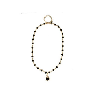 meghan browne ced-gb cedar gold necklace with black gemstones in the chain and a larger pendant in the middle