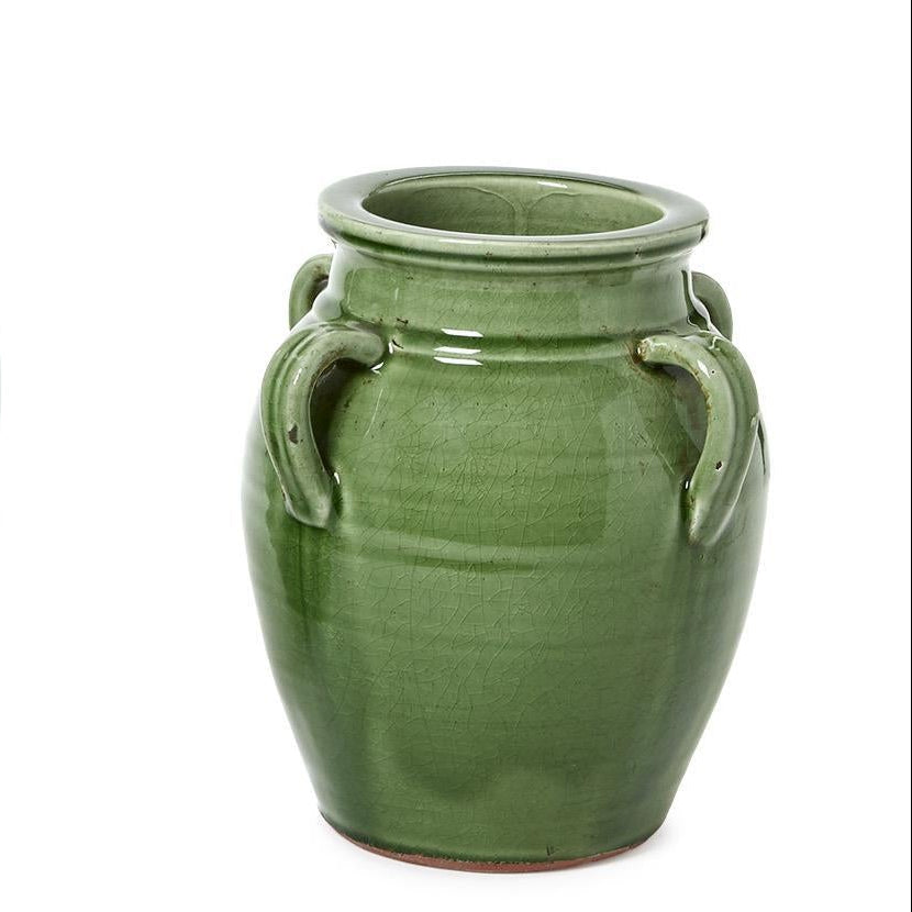 Small green ceramic vase on a white background