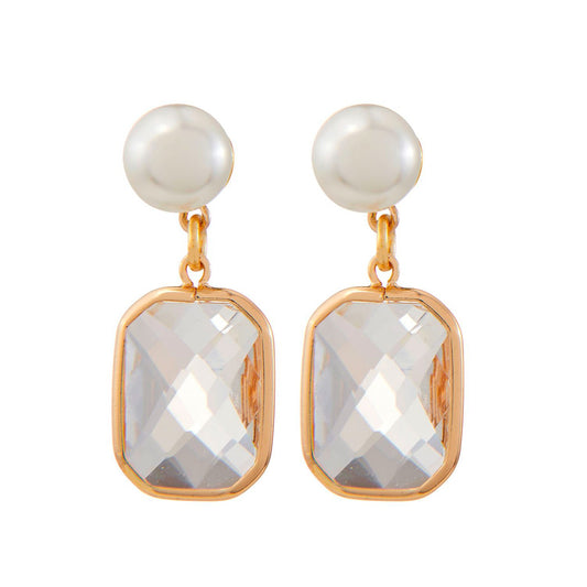 Pair of Charlie Paige Star Shine Earrings  with pearl tops and crystal-like bottoms on a white background