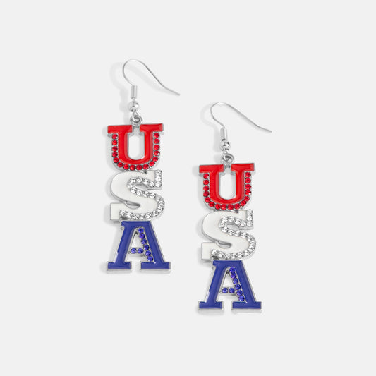Pair of dangle earrings by Coco+Carmen Whispers with 'USA' letter and gemstones on a white background