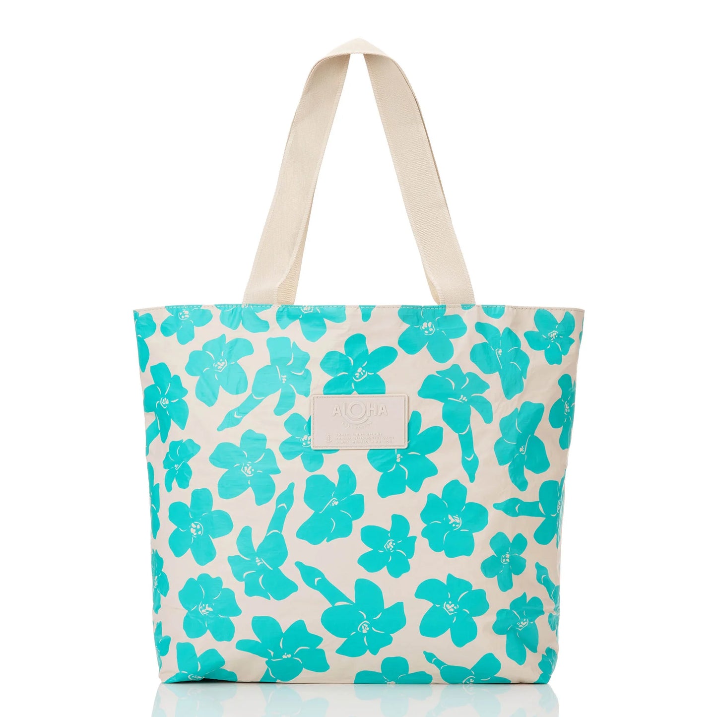Tote bag with turquoise floral pattern on a tan background
