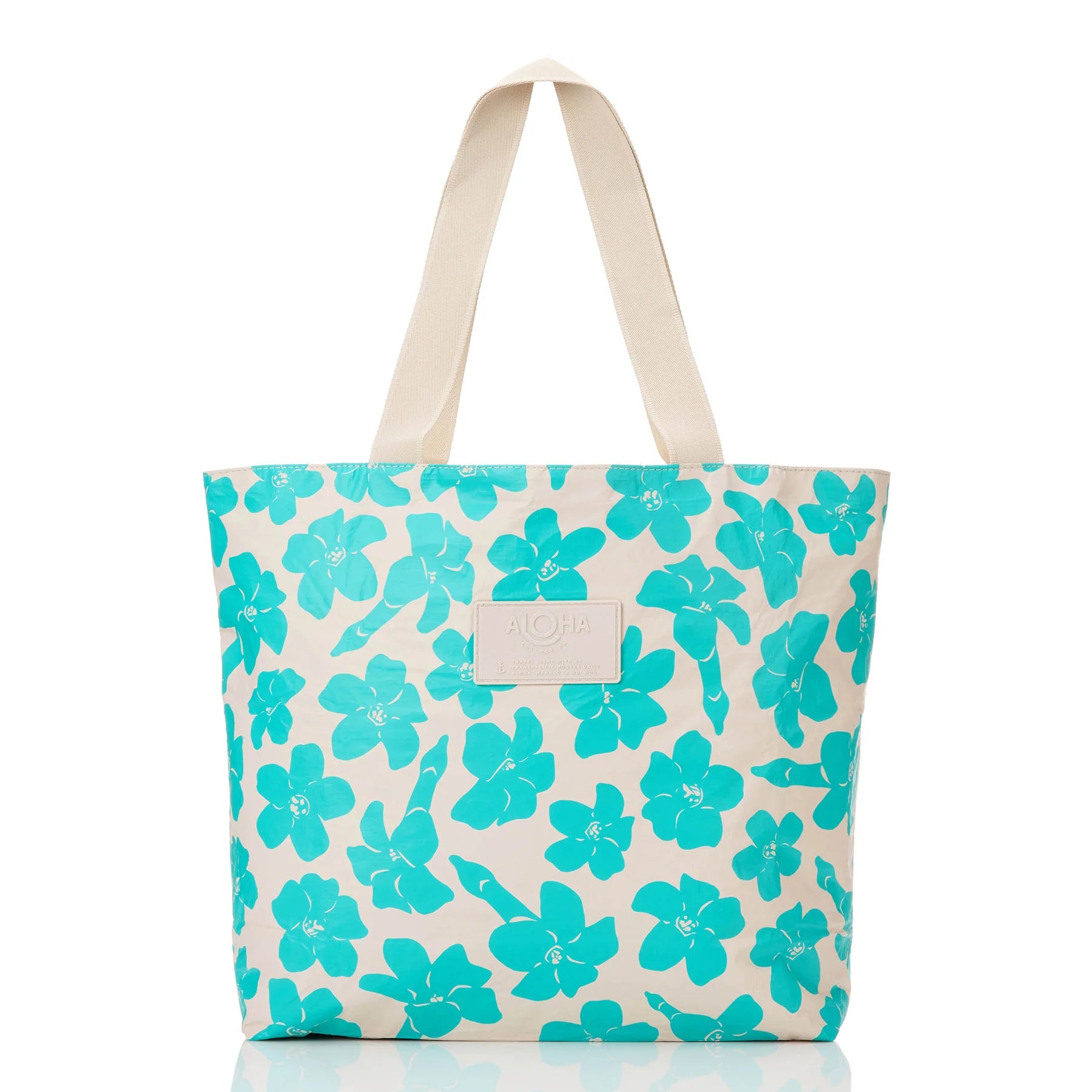 Tote bag with turquoise floral pattern on a tan background
