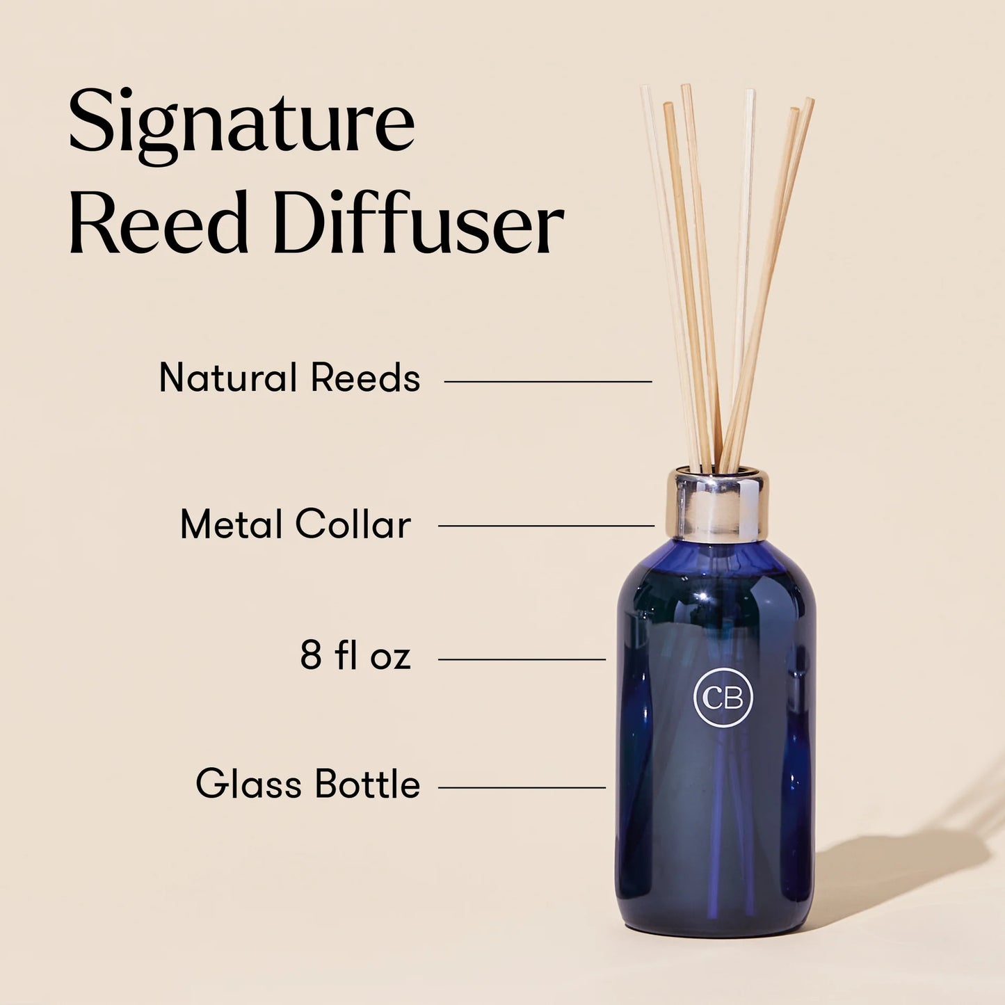 Signature reed diffuser with natural reeds metal collar and 8 oz glass navy blue bottle