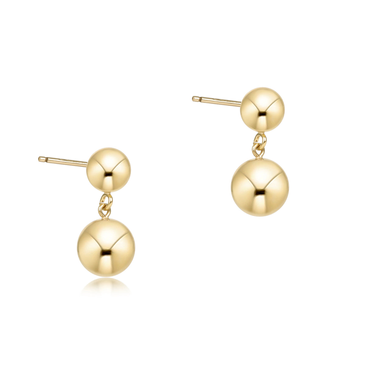 A pair of enewton classic 8mm gold drop earrings with a double-ball design, featuring a small polished ball connected to a larger ball by a delicate chain, set against a plain white background.  ECL8BADRSG