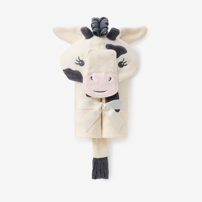 Plush cow folded towel with a bow on a white background by Elegant Baby