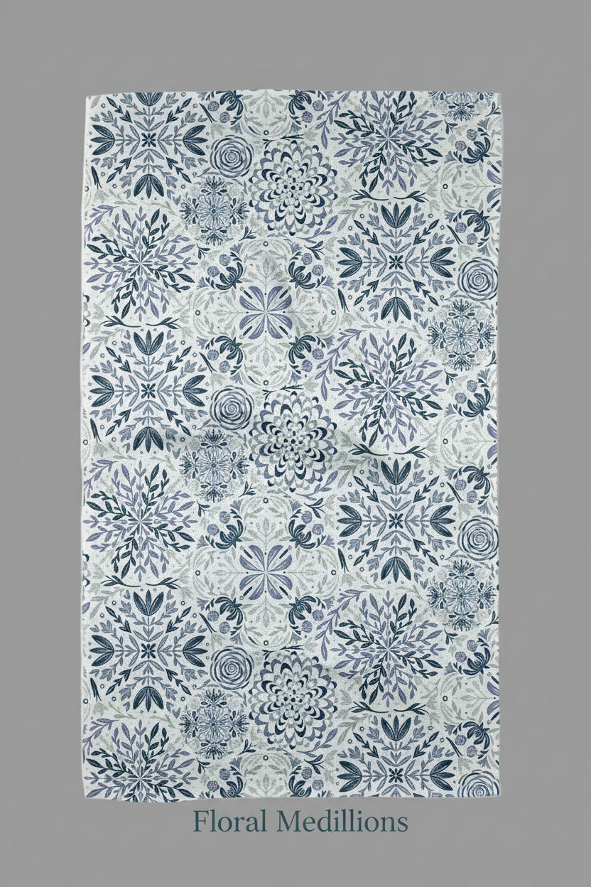 Decorative Geometry tea towel floral medallions with blue and white pattern on a white background