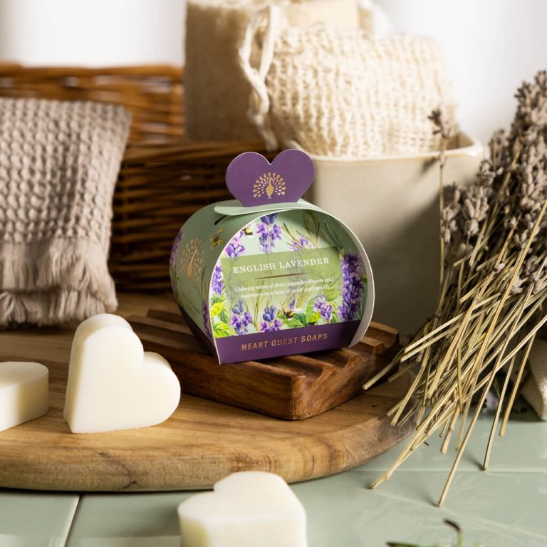 the english soap company and christina may guest soaps with 3 heart shaped 20g soap bars in english lavendar scent packaged in a green and purple package on a cutting board