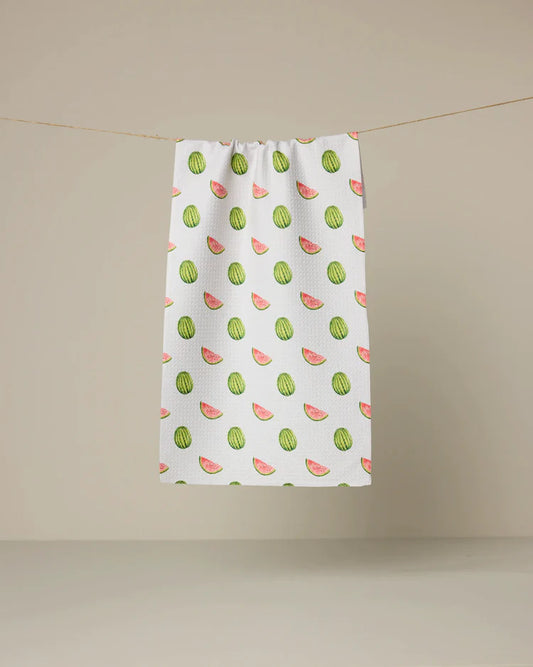 Highly absorbent and quick drying kitchen bar towel by Geometry made with Geoweave featuring the Melon Market print with green and red scattered watermelons.