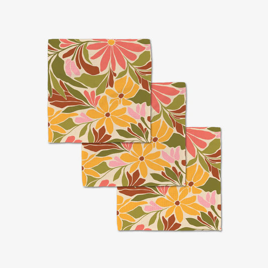 Set of three floral Blooming tan patterned dishcloths by Geometry on a white background