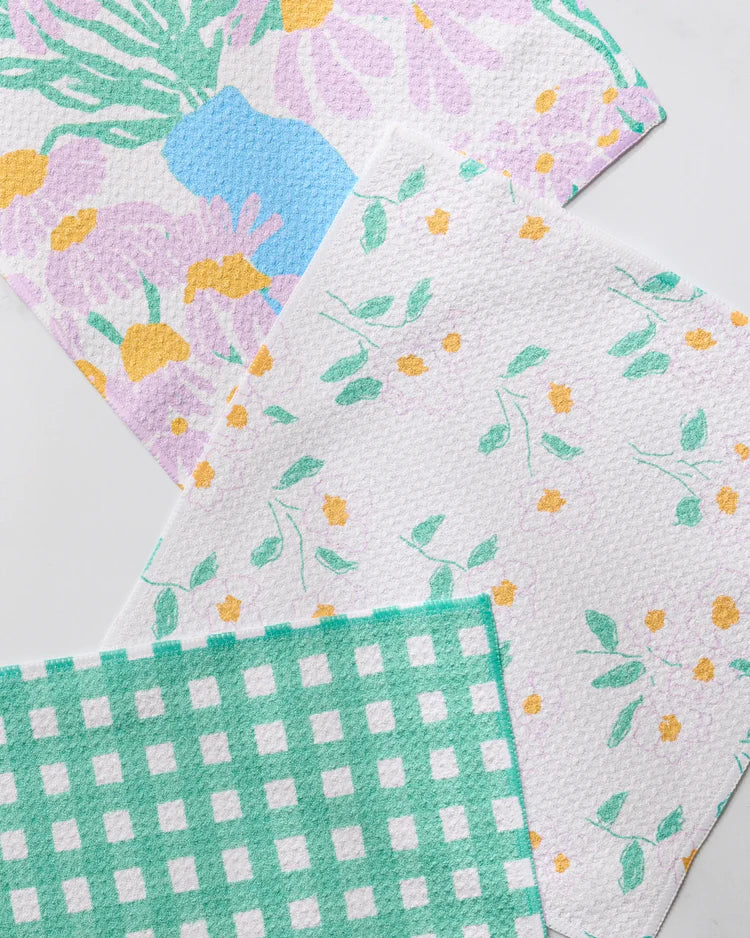Geometry Collection of dreaming of florals patterned dishcloths with floral, checkered, and abstract designs.