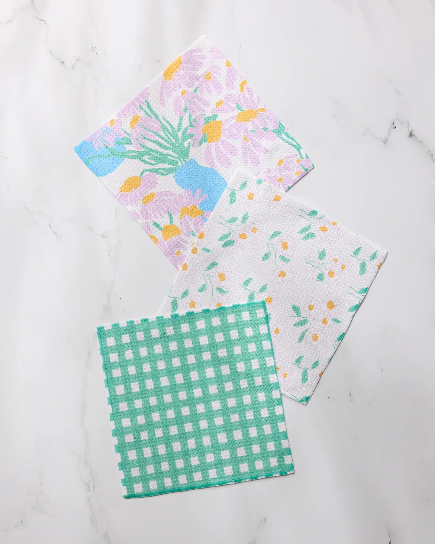 Geometry Dreaming of florals dishcloth fabric swatches with different patterns on a white background