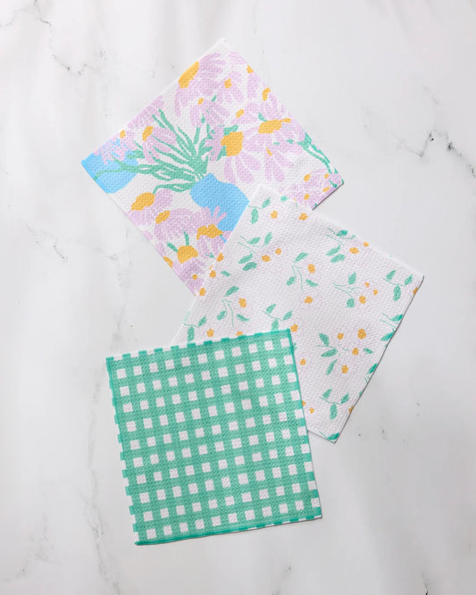 Geometry Dreaming of florals dishcloth fabric swatches with different patterns on a white background
