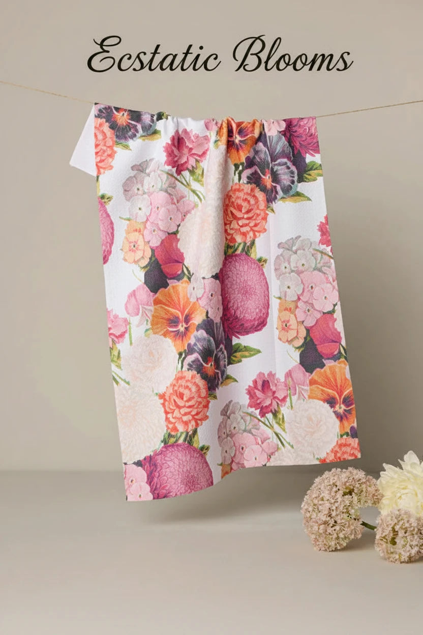 Geometry Floral-patterned Ecstatic blooms tea towel hanging on a line with flowers at the base.