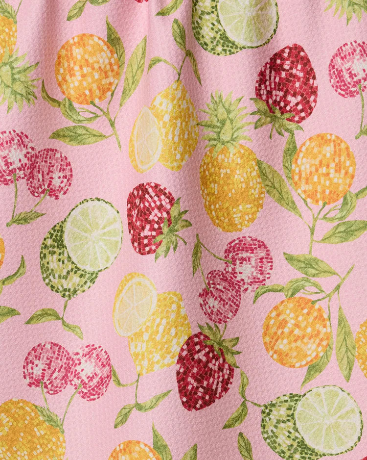 Geometry tea towel with Fruit disco pattern on pink fabric with pineapples, cherries, and limes.
