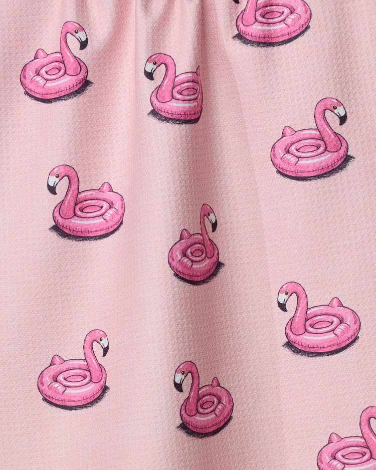 Geometry tea towel with Pattern of pink inflatable flamingo floats on a light pink background