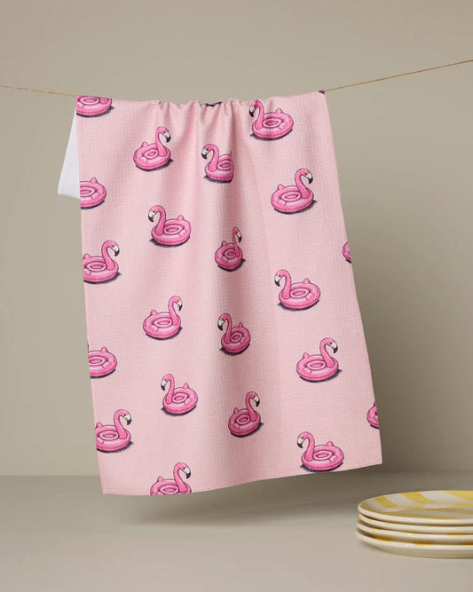 Highly absorbent and quick drying kitchen tea towel by Geometry made with Geoweave featuring the Flamingo Floatie Pattern in pink.
