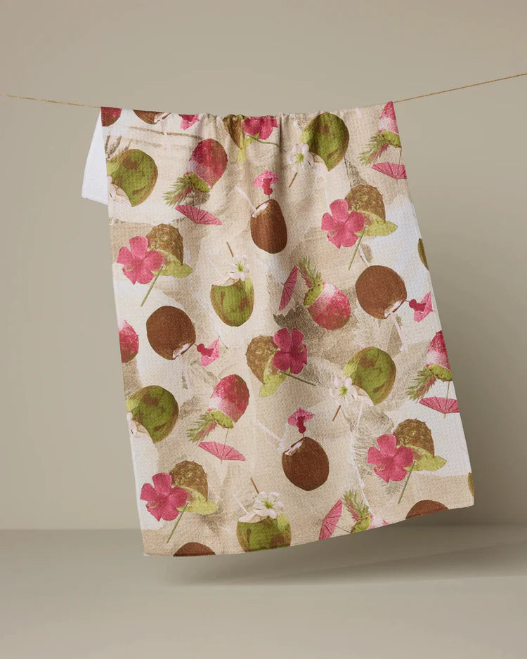 Geometry Vintage Tropi Drinks pattern with Floral and coconut patterned towel hanging on a line against a plain background
