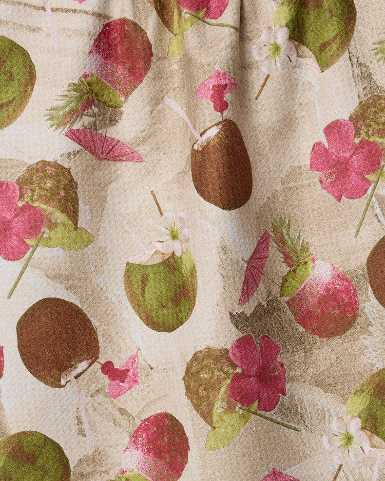 Geometry Vintage Tropi Drinks Fabric with a pattern of coconuts and pink flowers on a beige background